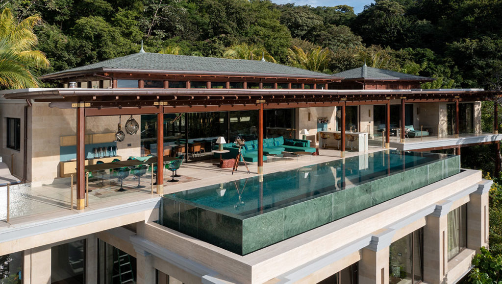 The Hive Residence second floor terrace with pool, sofa and a bar